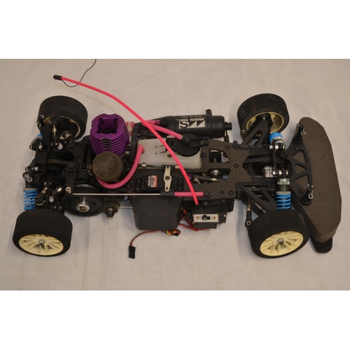 A 1/10 scale Mugen Seiki MTX-3 nitro powered radio control car (with  instruction manual) with an HPI