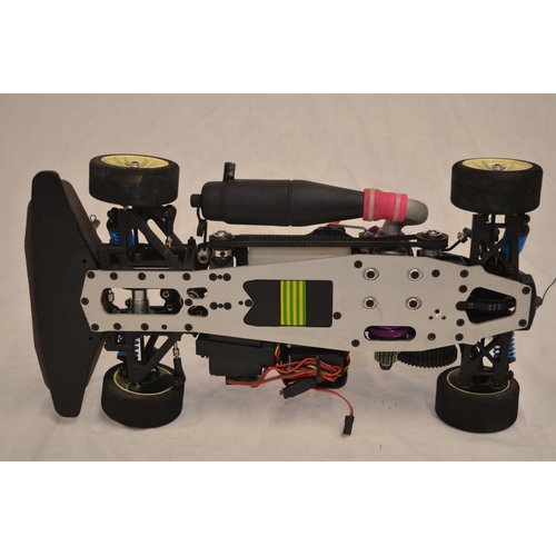 A 1/10 scale Mugen Seiki MTX-3 nitro powered radio control car