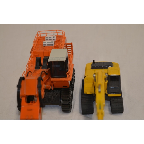 2 boxed diecast hydraulic excavator models: A 1/60 scale