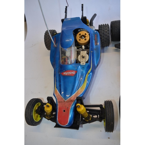 318 - Kyosho Sandmaster rc nitro car, a Kyosho nitro road car chassis, a Kyosho nitro off road buggy chass... 