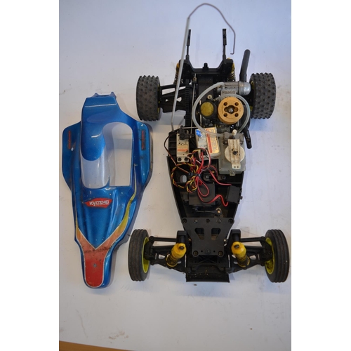 318 - Kyosho Sandmaster rc nitro car, a Kyosho nitro road car chassis, a Kyosho nitro off road buggy chass... 