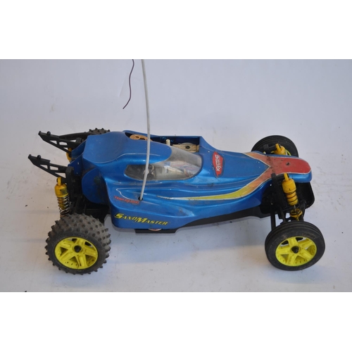 318 - Kyosho Sandmaster rc nitro car, a Kyosho nitro road car chassis, a Kyosho nitro off road buggy chass... 