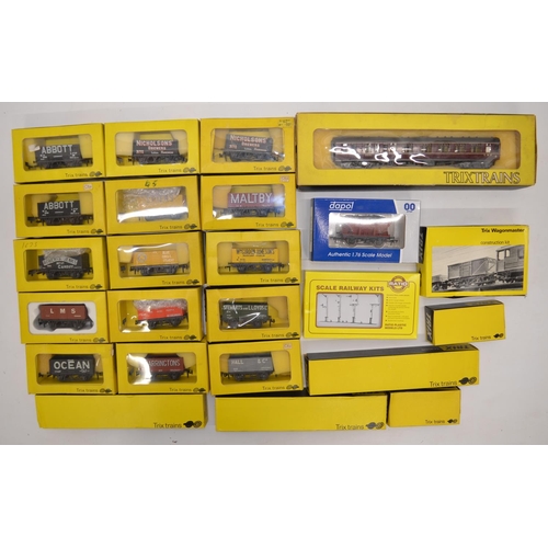 1080 - A collection of mostly Trix OO gauge railway wagons and passenger coaches. Also an unbuilt Ratio Mod... 