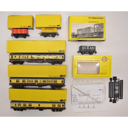 1080 - A collection of mostly Trix OO gauge railway wagons and passenger coaches. Also an unbuilt Ratio Mod... 