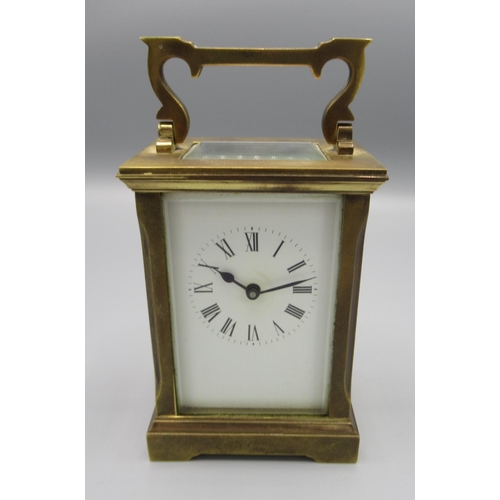 961 - C20th brass carriage time piece, with white enamel Roman dial, movement stamped with makers monogram... 