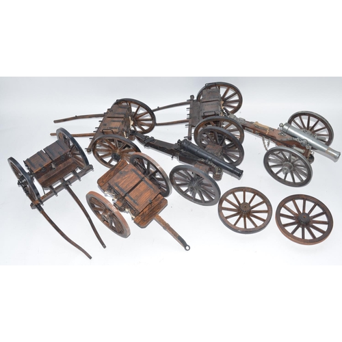 140 - Two large cannon models in metal and wood with ammunition tenders and a pair of spare wheels. Approx... 