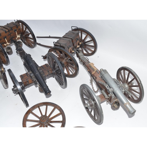 140 - Two large cannon models in metal and wood with ammunition tenders and a pair of spare wheels. Approx... 