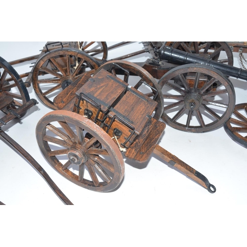 140 - Two large cannon models in metal and wood with ammunition tenders and a pair of spare wheels. Approx... 