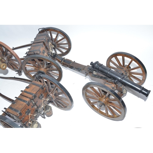 141 - Three large cannon models in metal and wood with ammunition tenders and some spare wheel rims. Appro... 