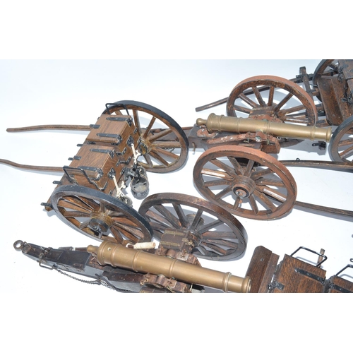 141 - Three large cannon models in metal and wood with ammunition tenders and some spare wheel rims. Appro... 