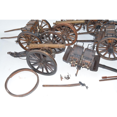 141 - Three large cannon models in metal and wood with ammunition tenders and some spare wheel rims. Appro... 