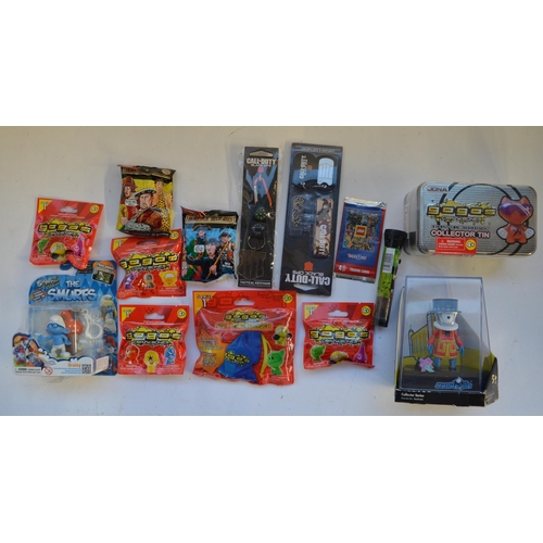 277 - Collection of games, lunch boxes, figure sets, a Saber hand held radio control transmitter, souvenir... 