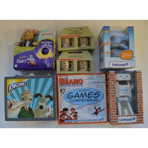 277 - Collection of games, lunch boxes, figure sets, a Saber hand held radio control transmitter, souvenir... 