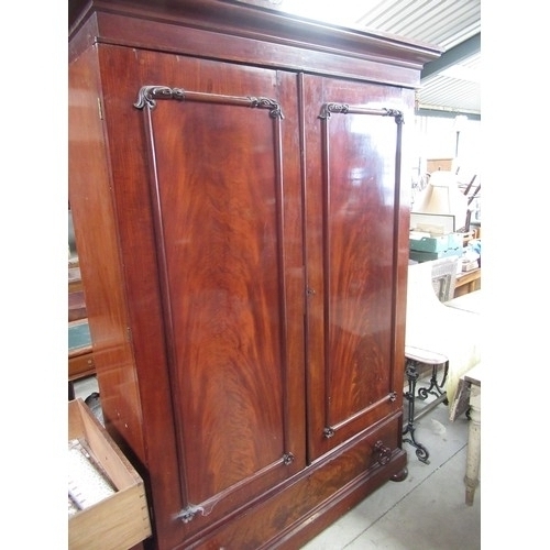 128 - Victorian mahogany two door wardrobe with moulded cornice above two panelled doors, fitted interior ... 