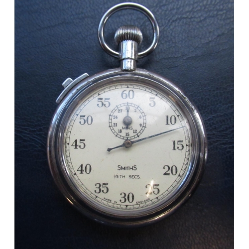 964 - Smiths '1/5th seconds' stop watch in steel case, with numbers 4GPOSSS/5840430 (in working order) and... 