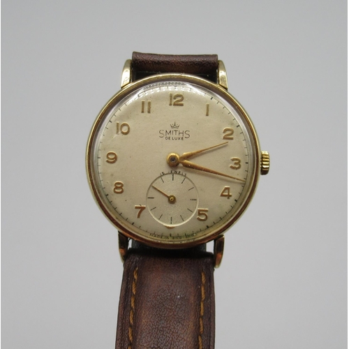 130 - 1950s Smiths Deluxe 9ct gold cased wristwatch, signed silvered dial with applied Arabic numerals, ou... 