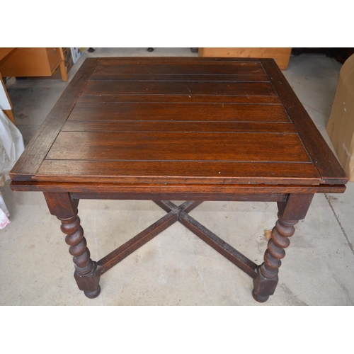 228 - 1930's oak draw leaf dining table on barley twist supports with cross stretcher, an oak stool and a ... 