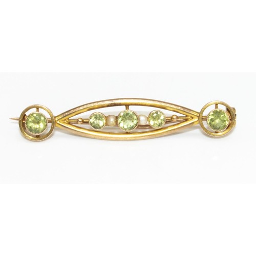 7 - 9ct yellow gold Art Nouveau brooch set with peridot and seed pearl, stamped 9ct, L5cm, 3.1g