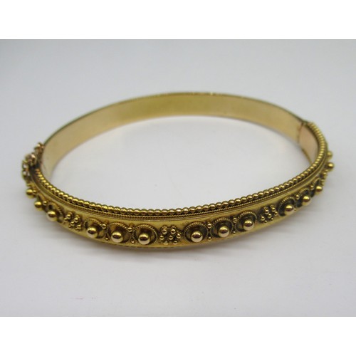 8 - 15ct yellow gold bangle with beaded detail and safety chain, stamped 15, 16.8g