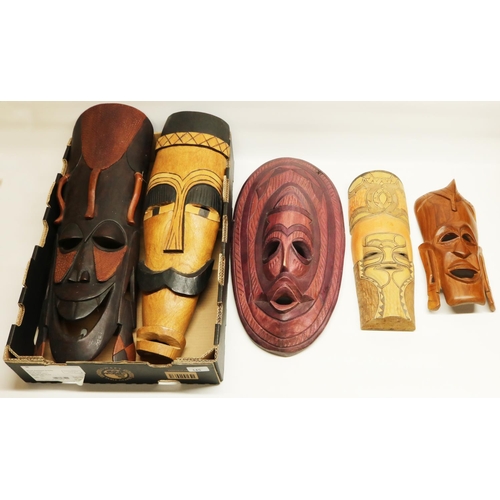 145 - Five modern African tribal style wooden face masks, various sizes, the largest L64cm