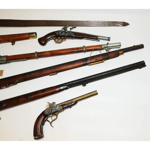 125 - 19th century flintlock and purcussion cap long guns, 3 x decorative wall hanging  pistols, wall hang... 