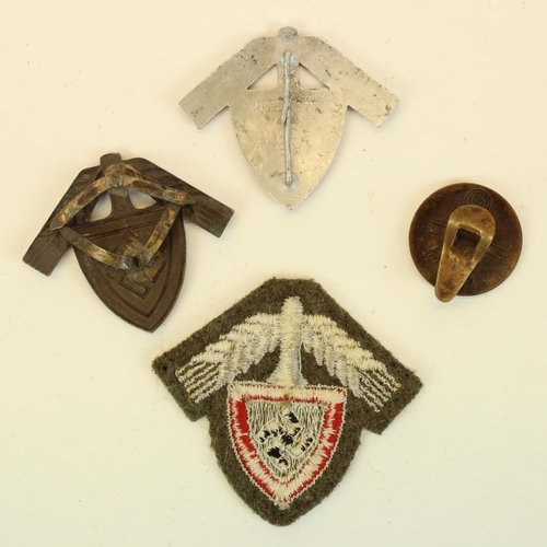 52 - Three German Third Reich Labour Service badges and a NSDAP enamel badge