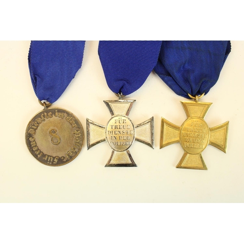 69 - Three German Third Reich Police Long Service medals, 1st, 2nd and 3rd class