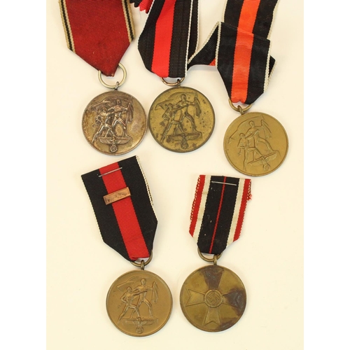 70 - Four German Third Reich Sudetenland medals and a 1939 War Merit medal