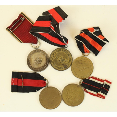 70 - Four German Third Reich Sudetenland medals and a 1939 War Merit medal