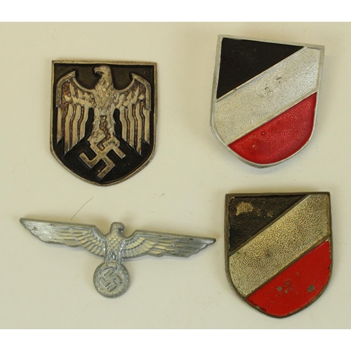 73 - German Third Reich tri colour helmet badges and two others