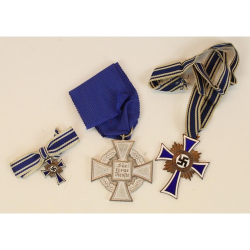 75 - German Third Reich enamel mothers cross medal and associated miniature and a Civil Service Faithful ... 