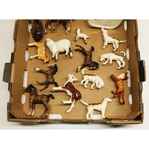 535 - Collection of Beswick animals including huntsman on rearing horse, hounds, fox, foals, etc., most AF... 