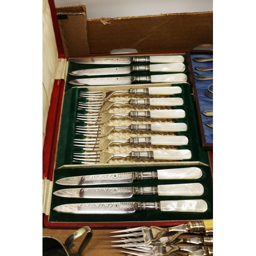 543 - Silver plated cutlery including a cased EPNS fruit knife and fork set with mother of pearl handles, ... 