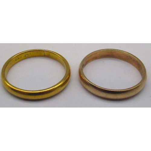 122 - 9ct yellow gold plain wedding band, stamped 375, size U, and another yellow metal ring with worn hal... 