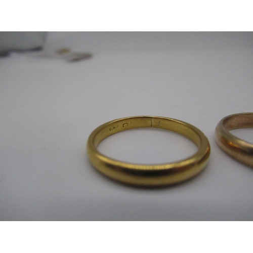 122 - 9ct yellow gold plain wedding band, stamped 375, size U, and another yellow metal ring with worn hal... 