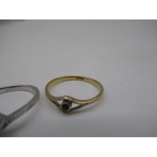 123 - 18ct yellow gold ring set with black stone, size Q, 2.0g, a yellow metal ring with circular face set... 