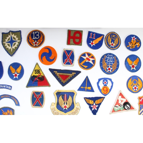 208 - Collection of US military regimental and squadron cloth badges and patches, mainly WW2 era including... 