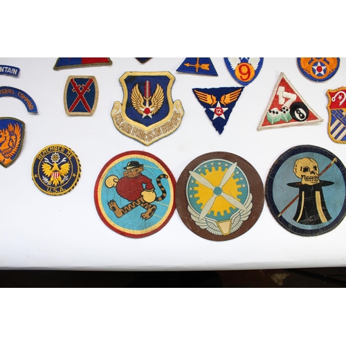 208 - Collection of US military regimental and squadron cloth badges and patches, mainly WW2 era including... 