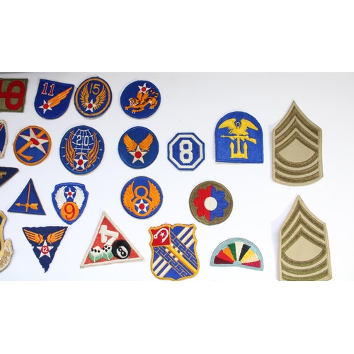 208 - Collection of US military regimental and squadron cloth badges and patches, mainly WW2 era including... 