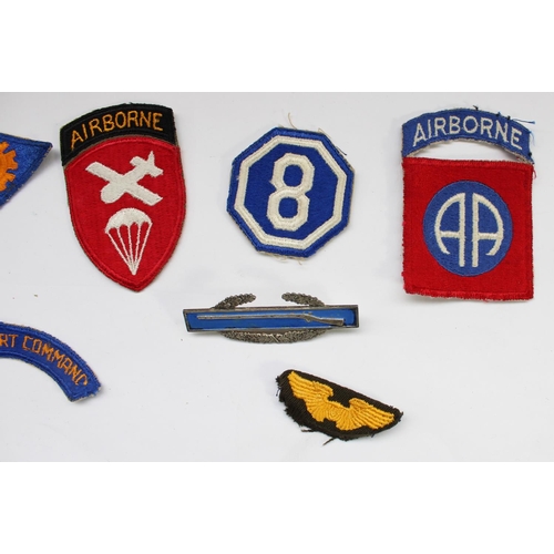 209 - Collection of WWII era US military cloth and bullion patches and badges, including a US Navy Officer... 