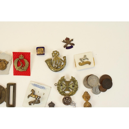 87 - Selection of British military cap badges, emblems, belt buckles,  mainly WWI through WWII, highlight... 