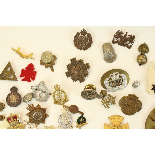 89 - Large collection of military cap badges, lapel badges, buttons etc. highlights boxed 14th West Yorks... 