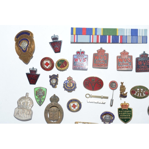 220 - Collection of mostly British Empire, Great War and WWII era lapel pins and cap badges including 5 WV... 