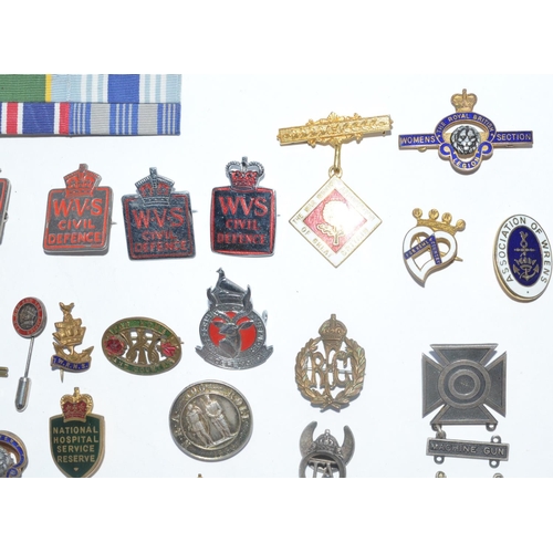 220 - Collection of mostly British Empire, Great War and WWII era lapel pins and cap badges including 5 WV... 