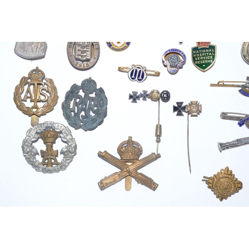 220 - Collection of mostly British Empire, Great War and WWII era lapel pins and cap badges including 5 WV... 