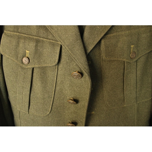 169 - WWII period US Marine dress uniform of stitched wool jacket and trousers, later patch for Marine Cor... 