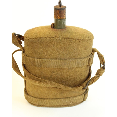 173 - Selection of militaria to include British MkVII water bottle, WWII Mk VII chest respirator and pouch... 