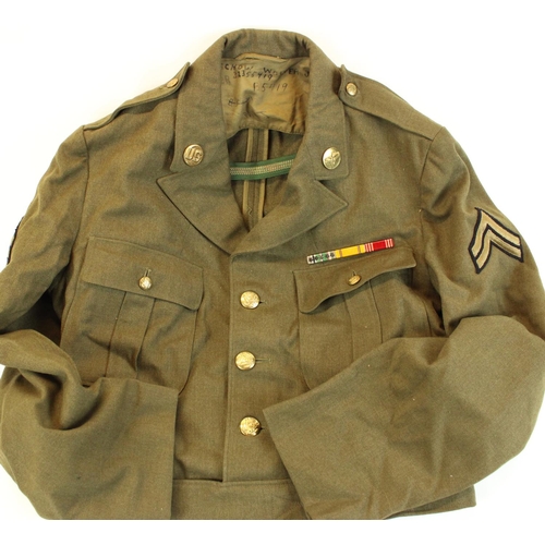 176 - US military WWII period wool uniform of jacket, trousers and forage cap together with a later tan sa... 