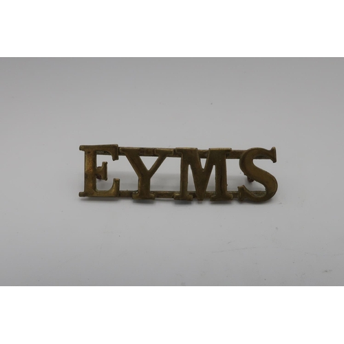 1205 - Brass E.Y.M.S cap badge