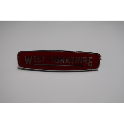 1208 - West Yorkshire red enamel cap badge